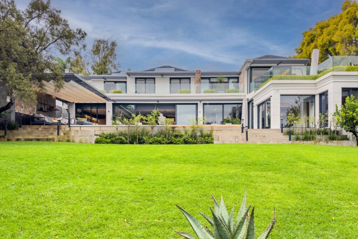 Luxury garden design and landscaping project at a Dainfern Estate residence featuring premium planting, lush lawns, irrigation systems, and elegant outdoor living spaces.